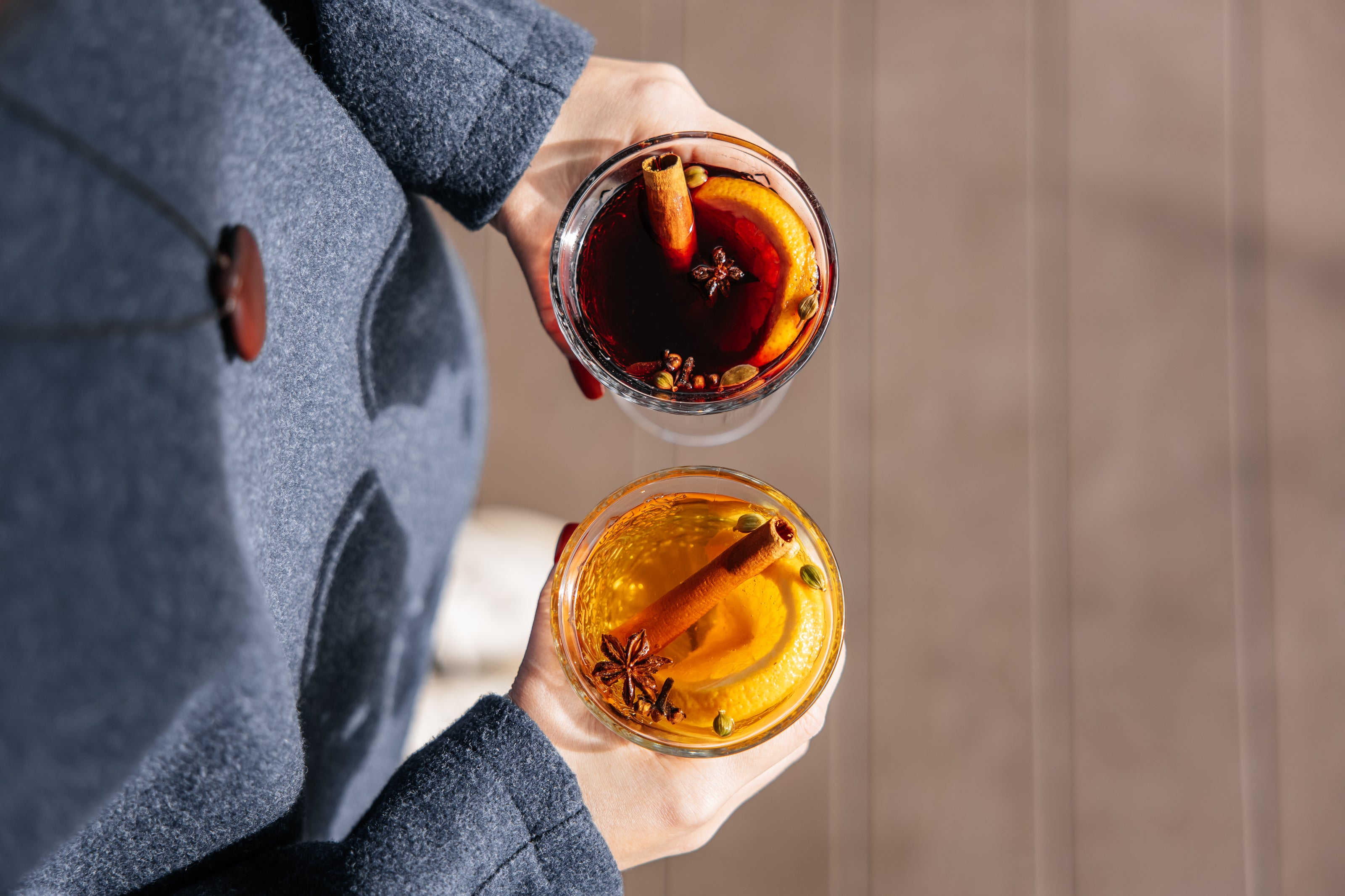 white-red-mulled-wine-glasses-is-held-girls-hands-top-view-copy-space-inscription.jpg__PID:086e0f49-9302-4ddd-b7ae-b793a0a423ac
